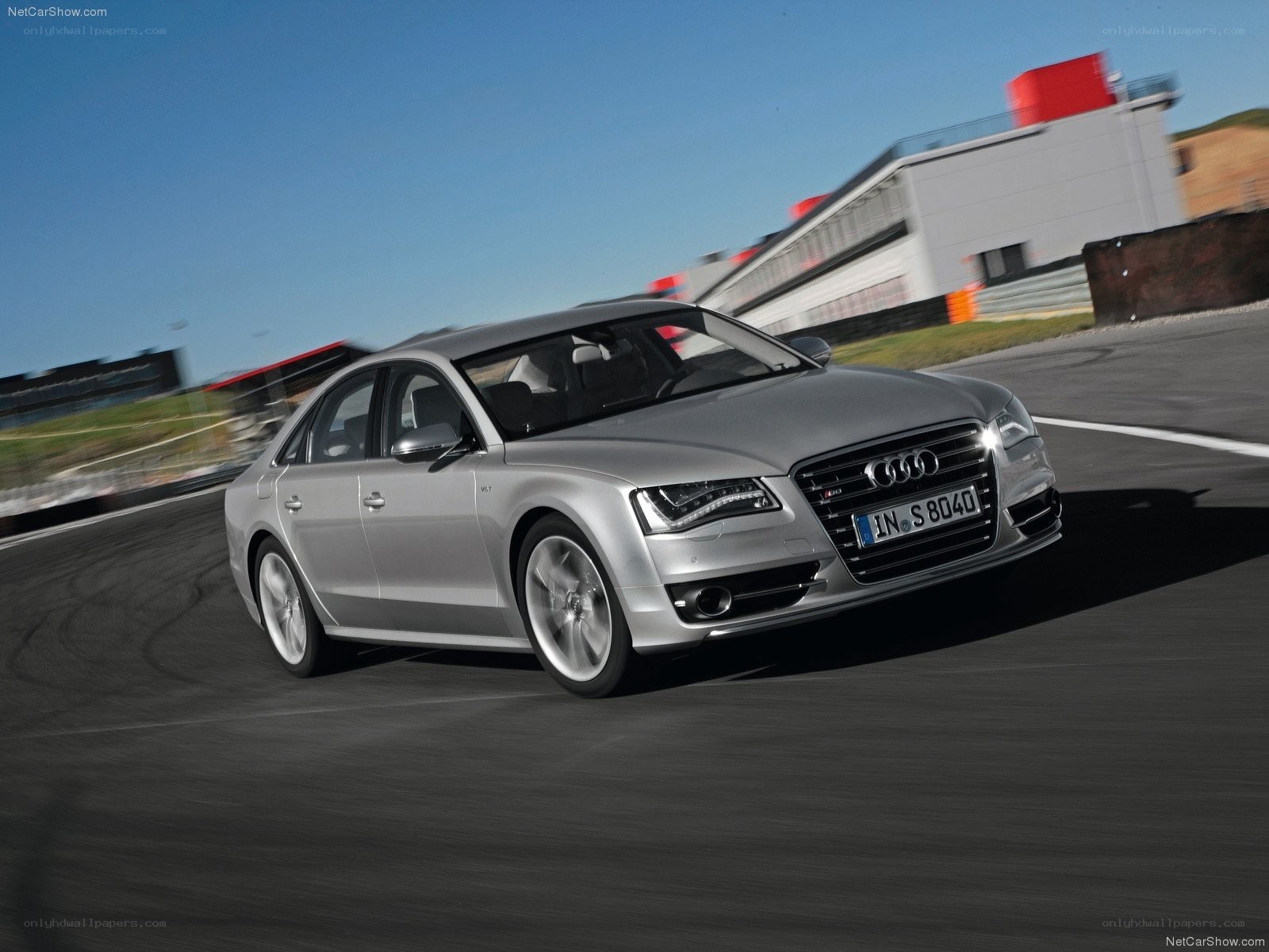 Silver Audi S8 on a racetrack