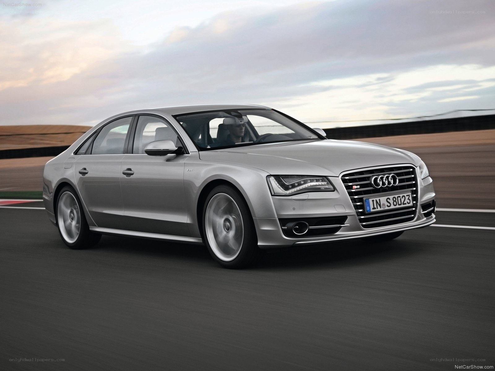 Silver Audi S8 on a racetrack