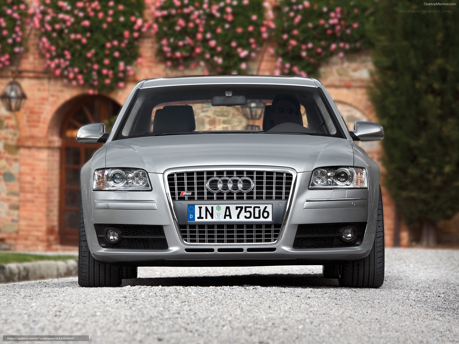 Silver Audi S8 parked in front of villa