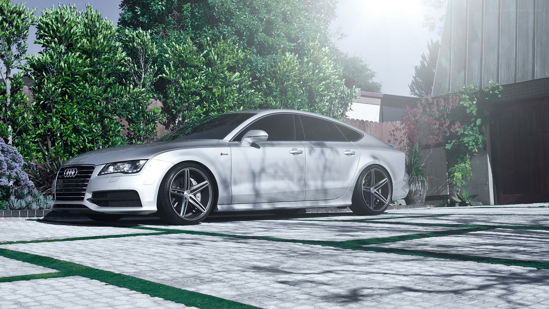 silver audi sedan in driveway