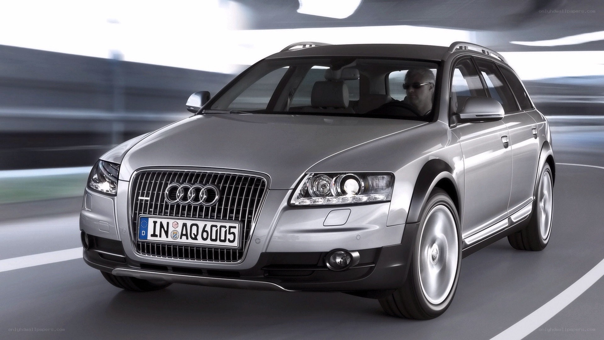 silver audi station wagon in motion
