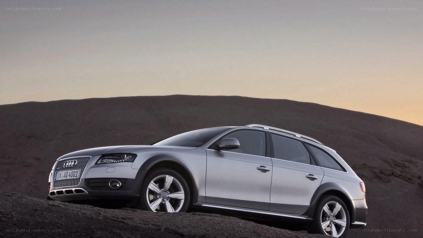 Silver Audi station wagon on hill