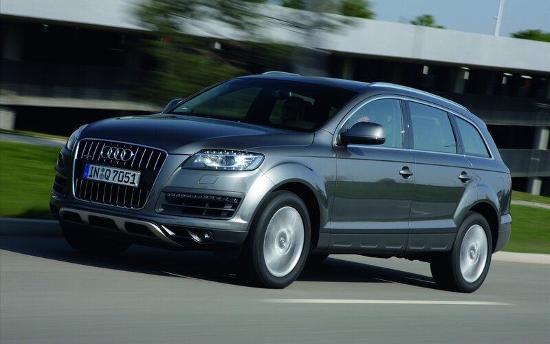 silver audi suv in motion