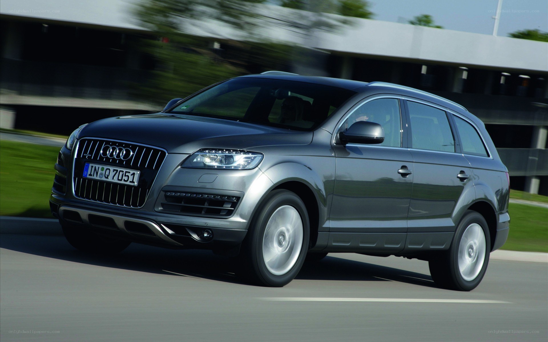 silver audi suv in motion