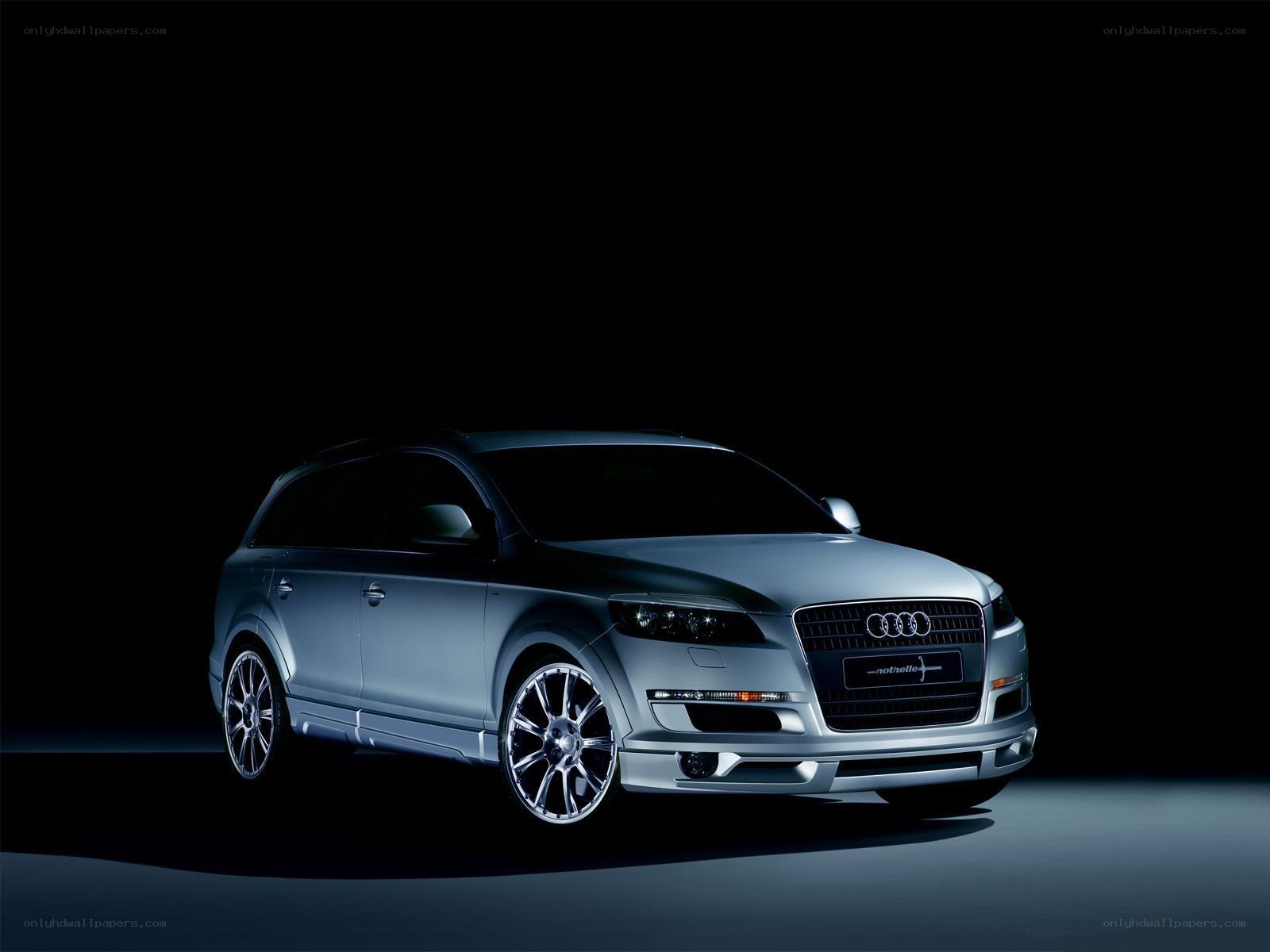 silver audi suv on black background