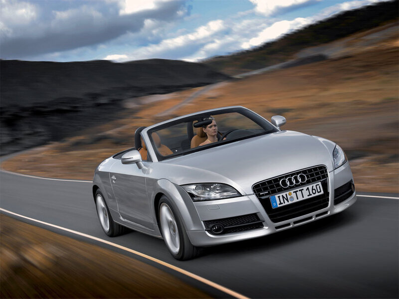 Silver Audi TT driving on road