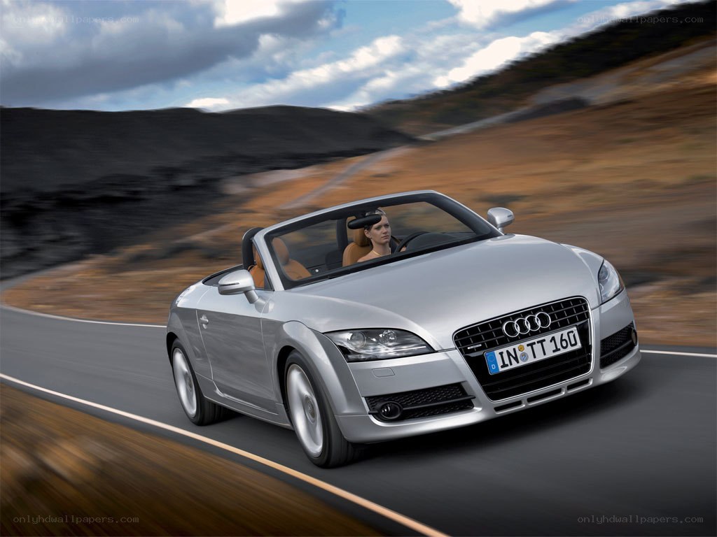 Silver Audi TT driving on road