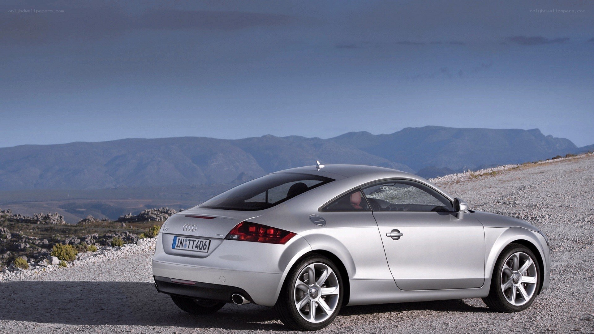 Silver Audi TT on a mountain road