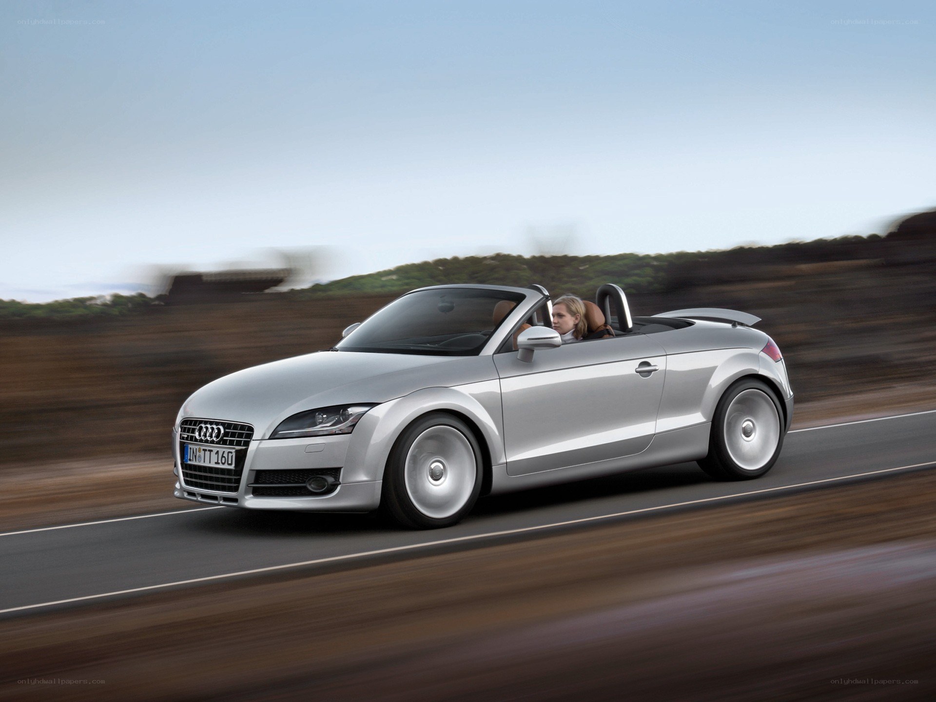 Silver Audi TT Roadster in motion