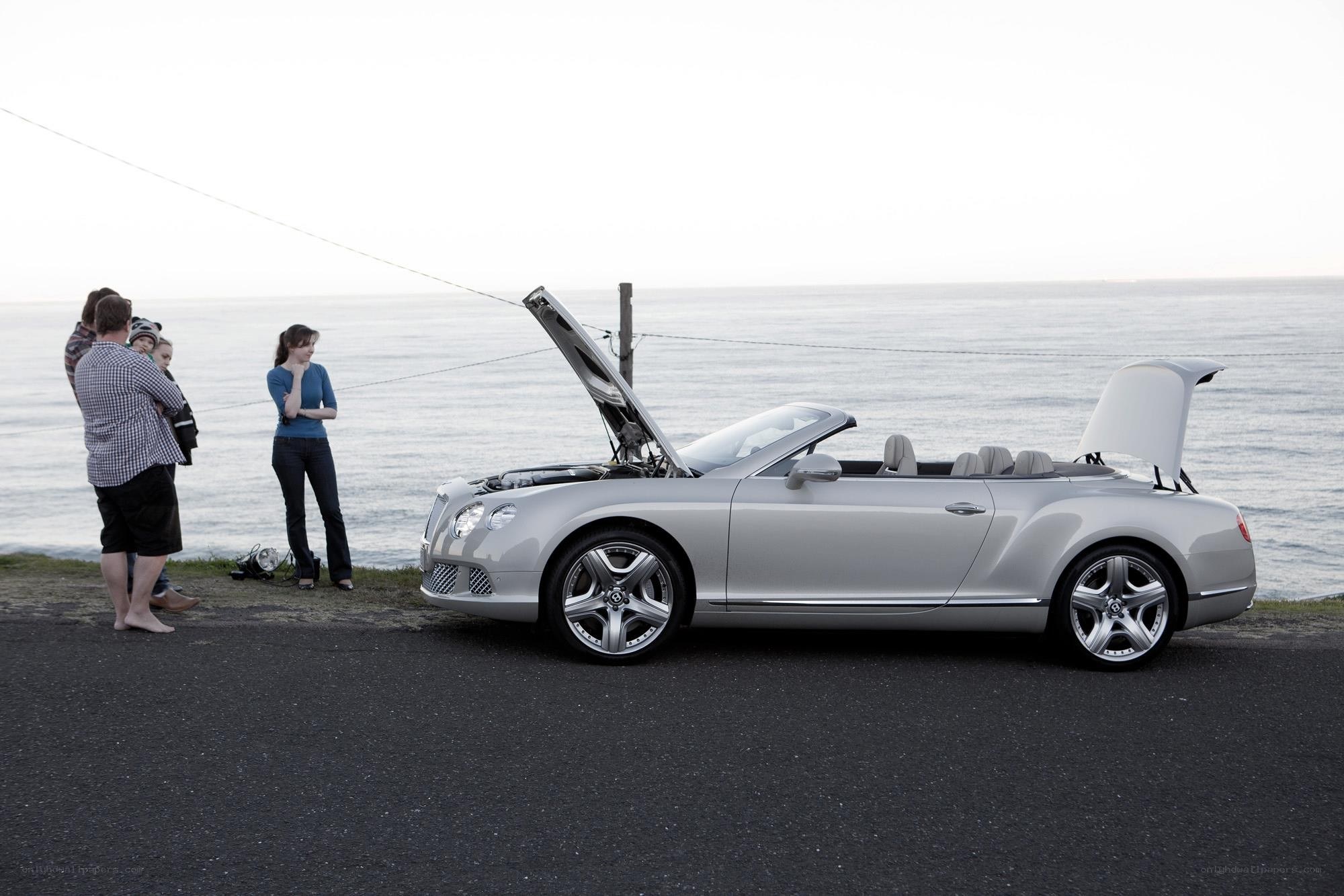 Silver Bentley by the sea