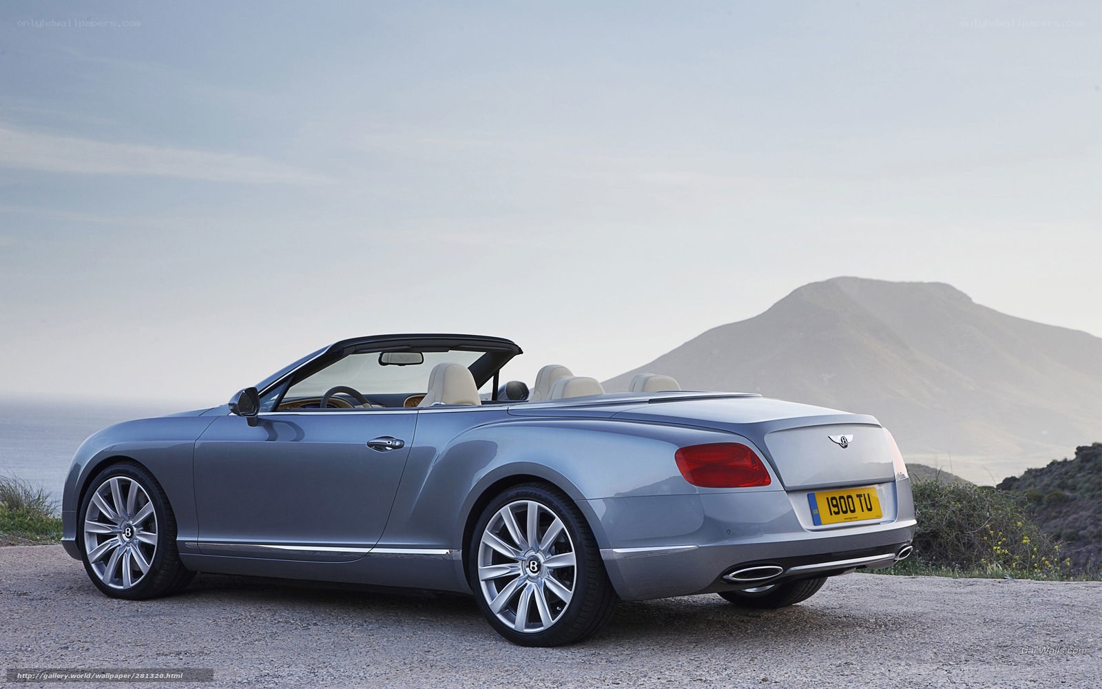 Silver Bentley convertible on cliff