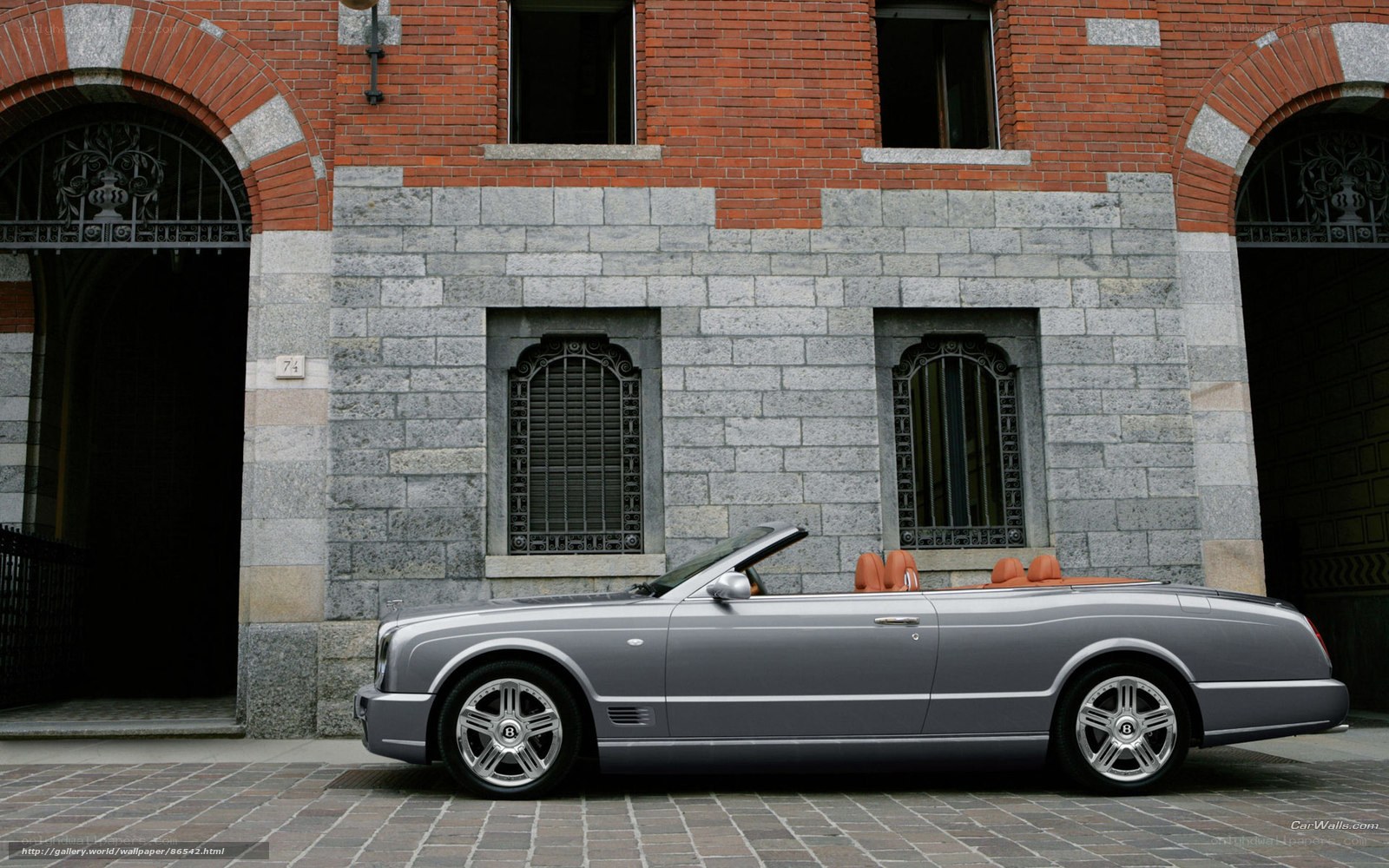 Silver Bentley convertible on cobblestones