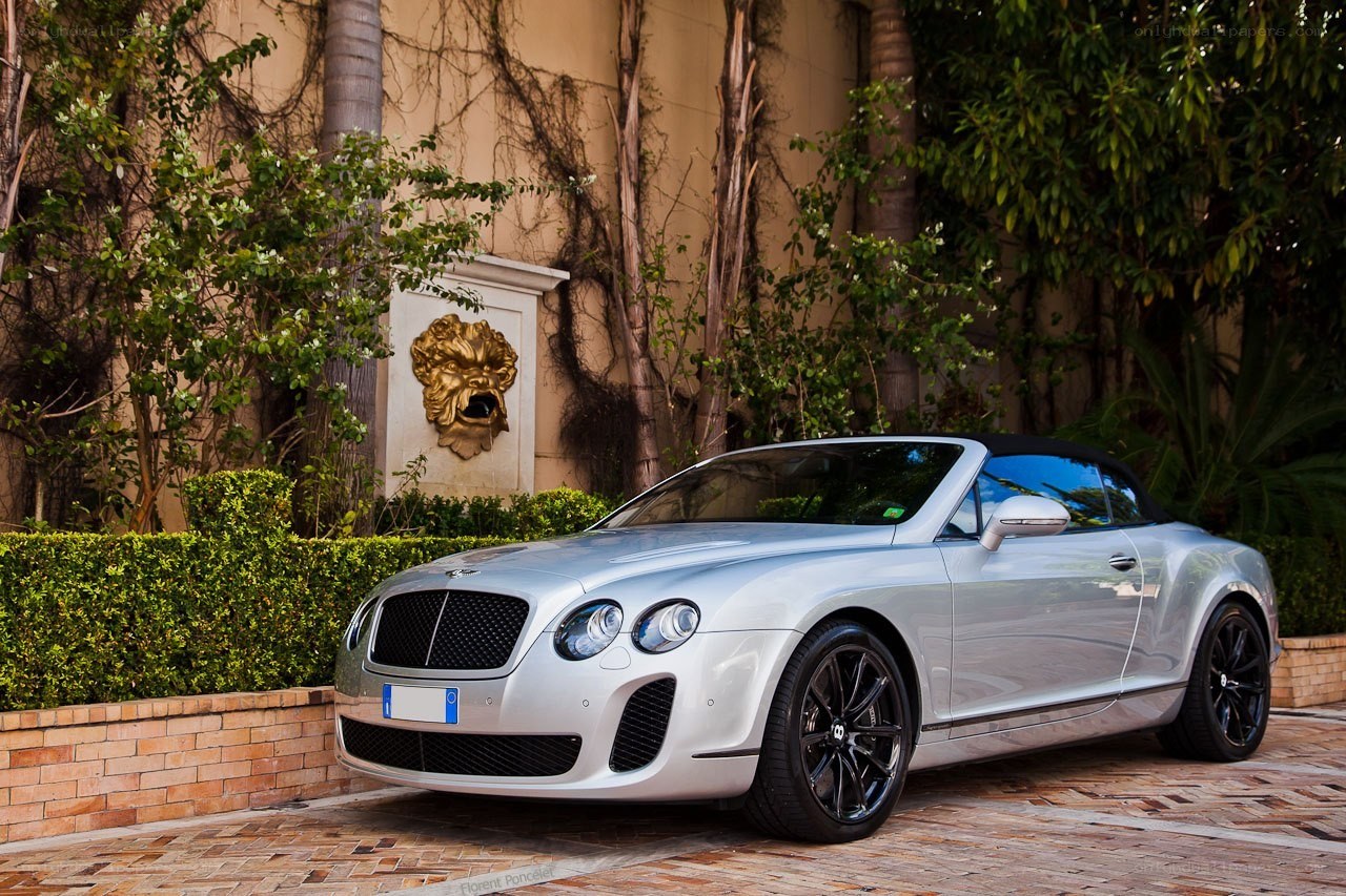 Silver Bentley convertible parked