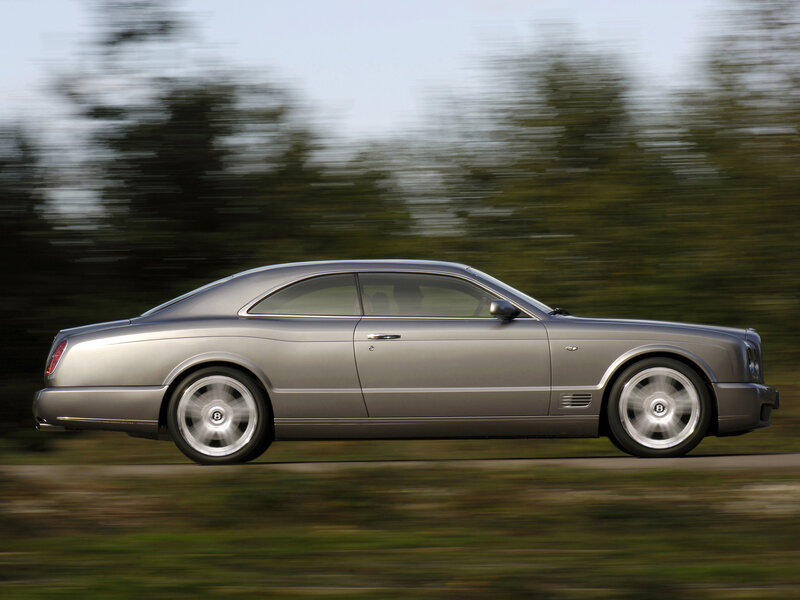 silver bentley coupe in motion