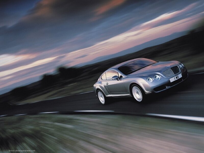 silver bentley driving on road