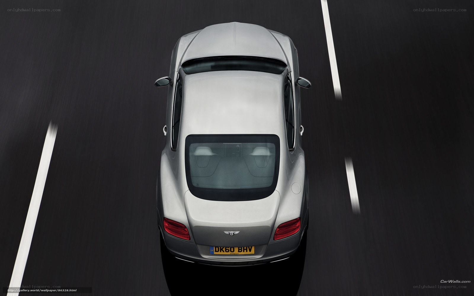 silver bentley driving on road