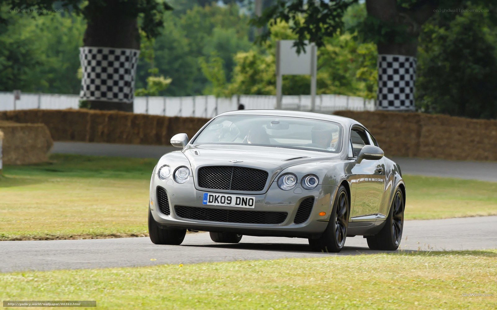 Silver Bentley on a track