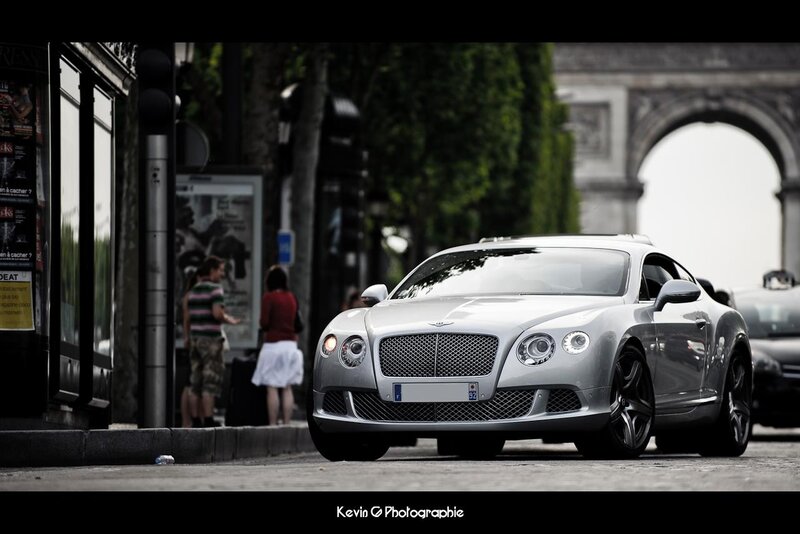 Silver Bentley on city street