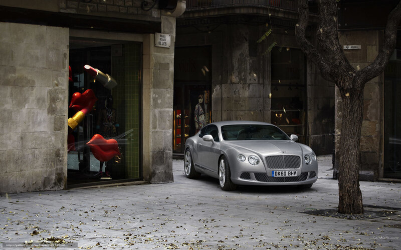 Silver Bentley on city street