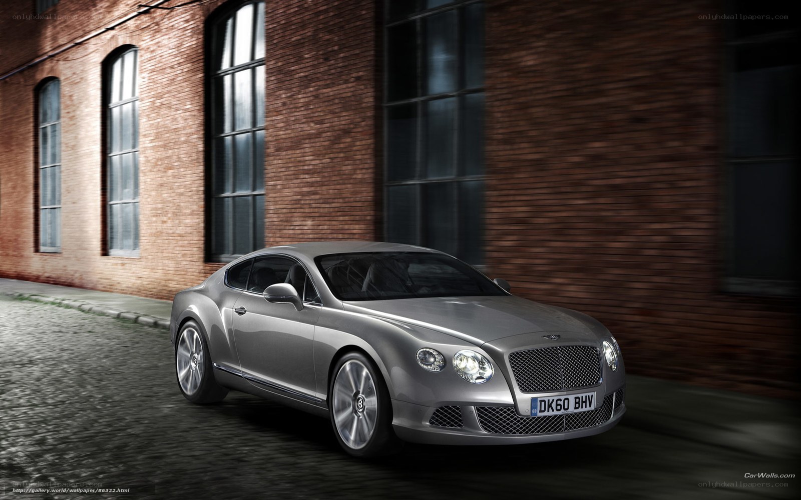 Silver Bentley on cobblestone street