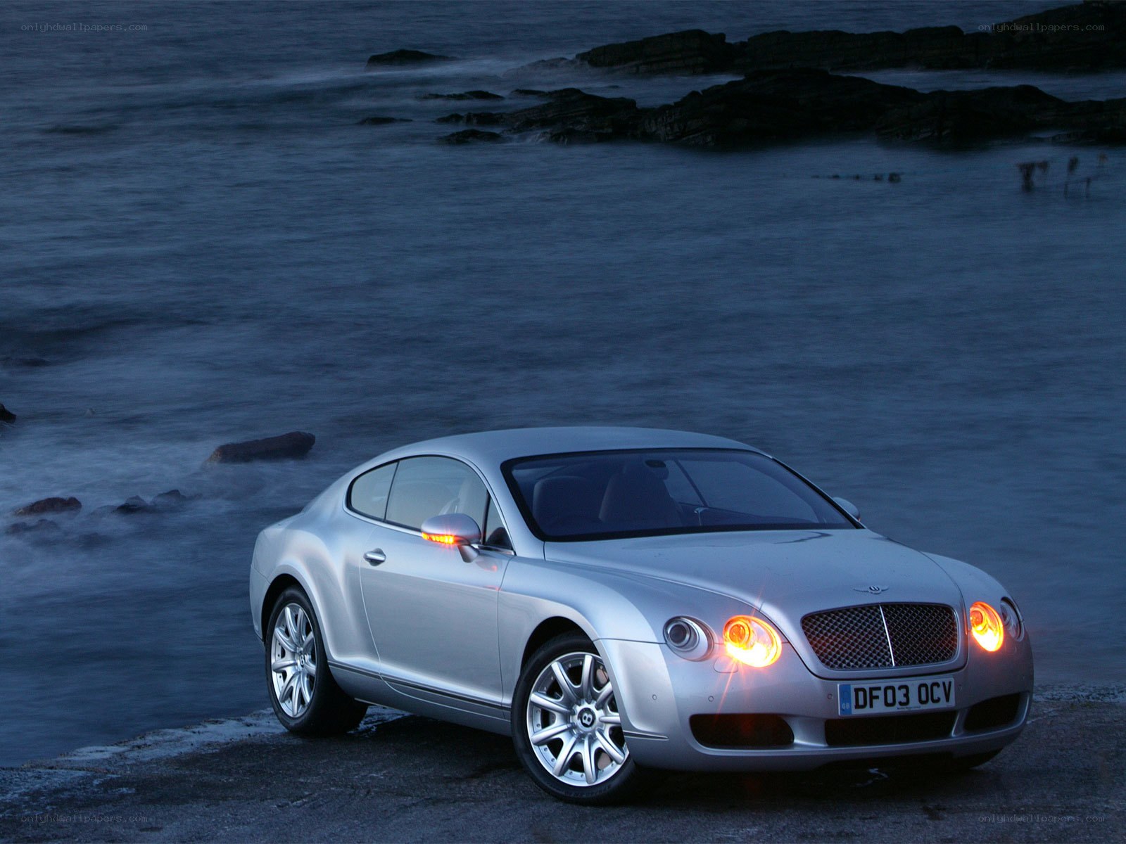 Silver Bentley on the coast