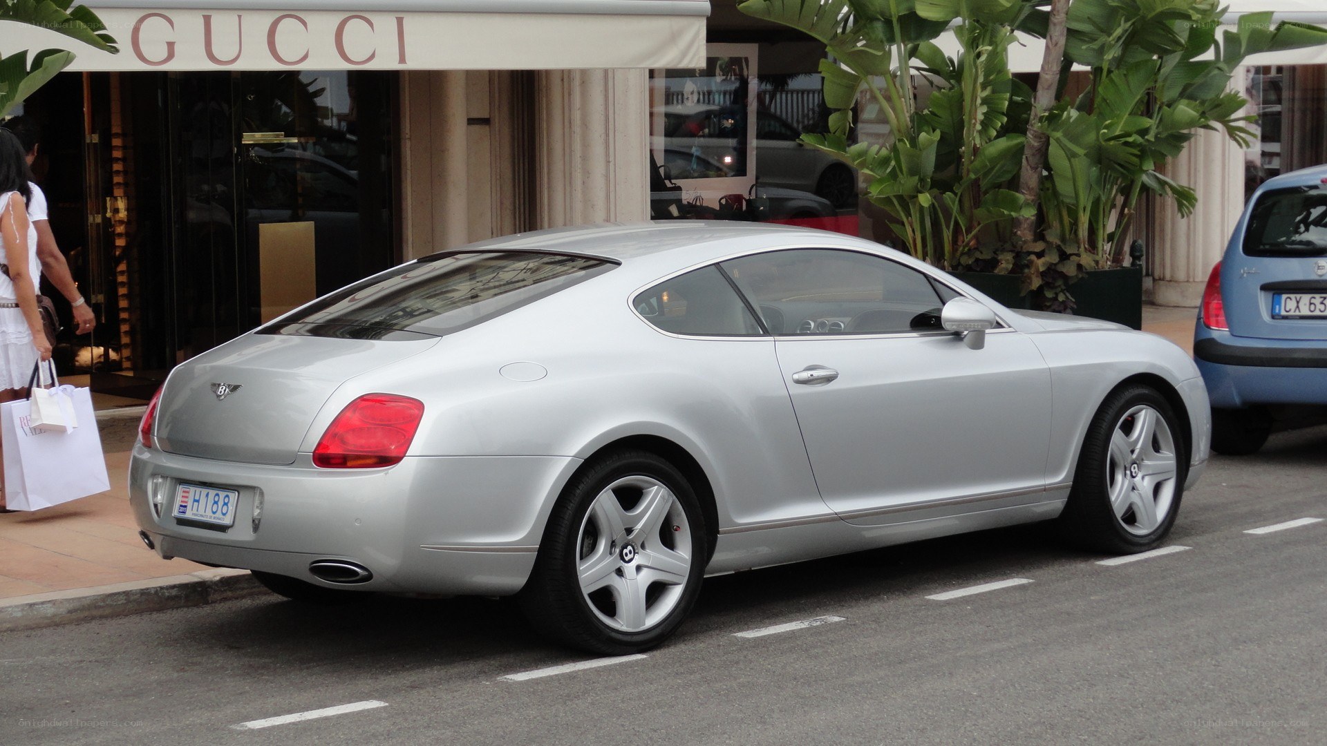 Silver Bentley parked on street