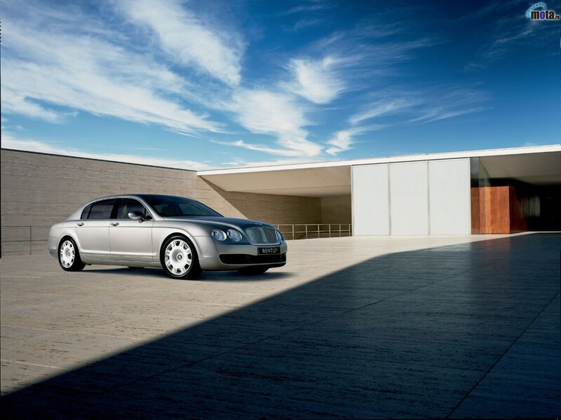 Silver Bentley parked outside