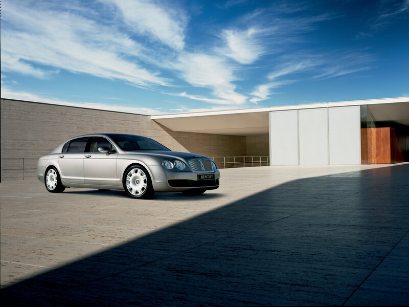 Silver Bentley parked outside