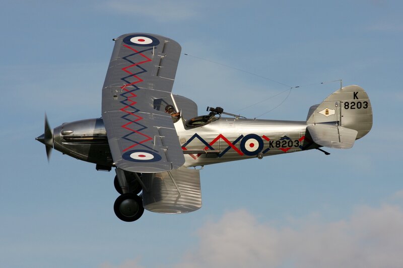 Silver Biplane in Flight — Dynamic