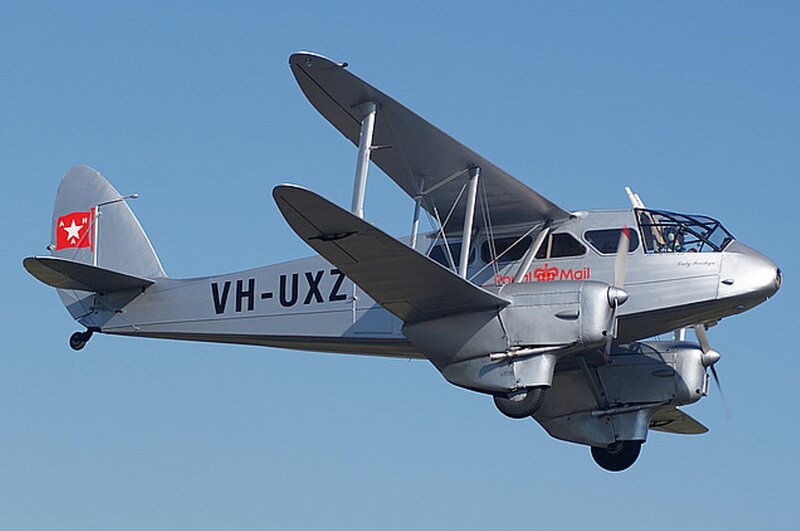 Silver Biplane in Flight — Gray, Calm
