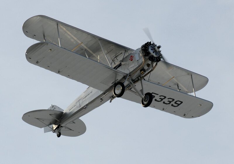 Silver Biplane in Flight — Gray