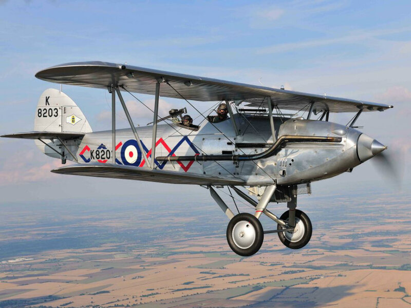 Silver Biplane in Flight — Serene, Afternoon
