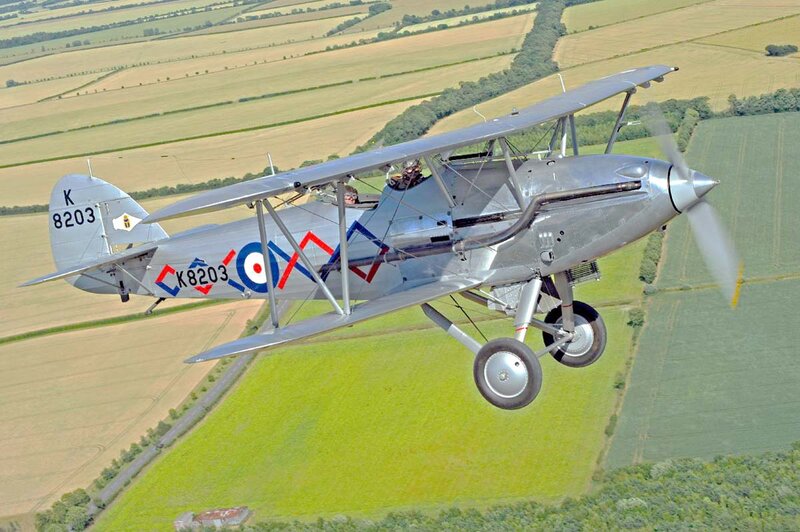 Silver Biplane in Flight — Serene