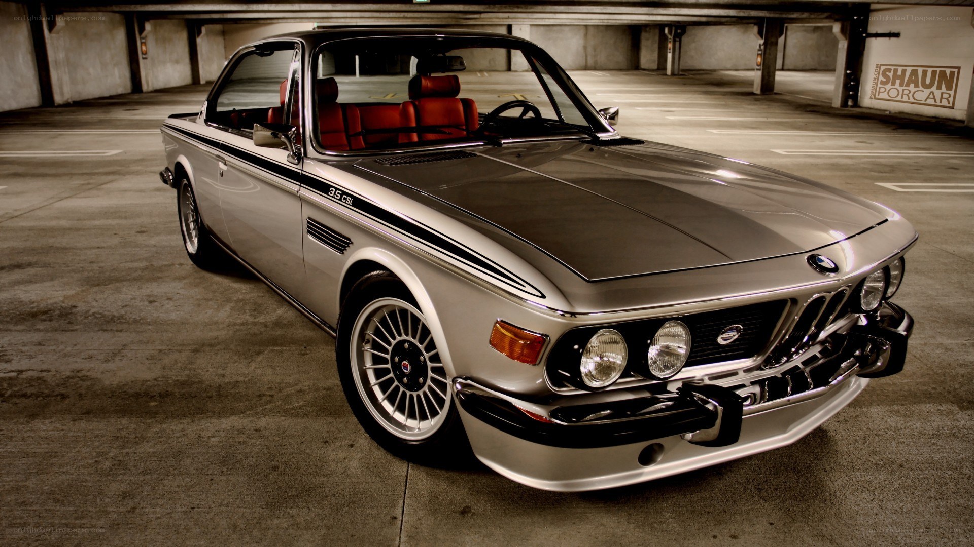 silver bmw 3.5 csi in garage