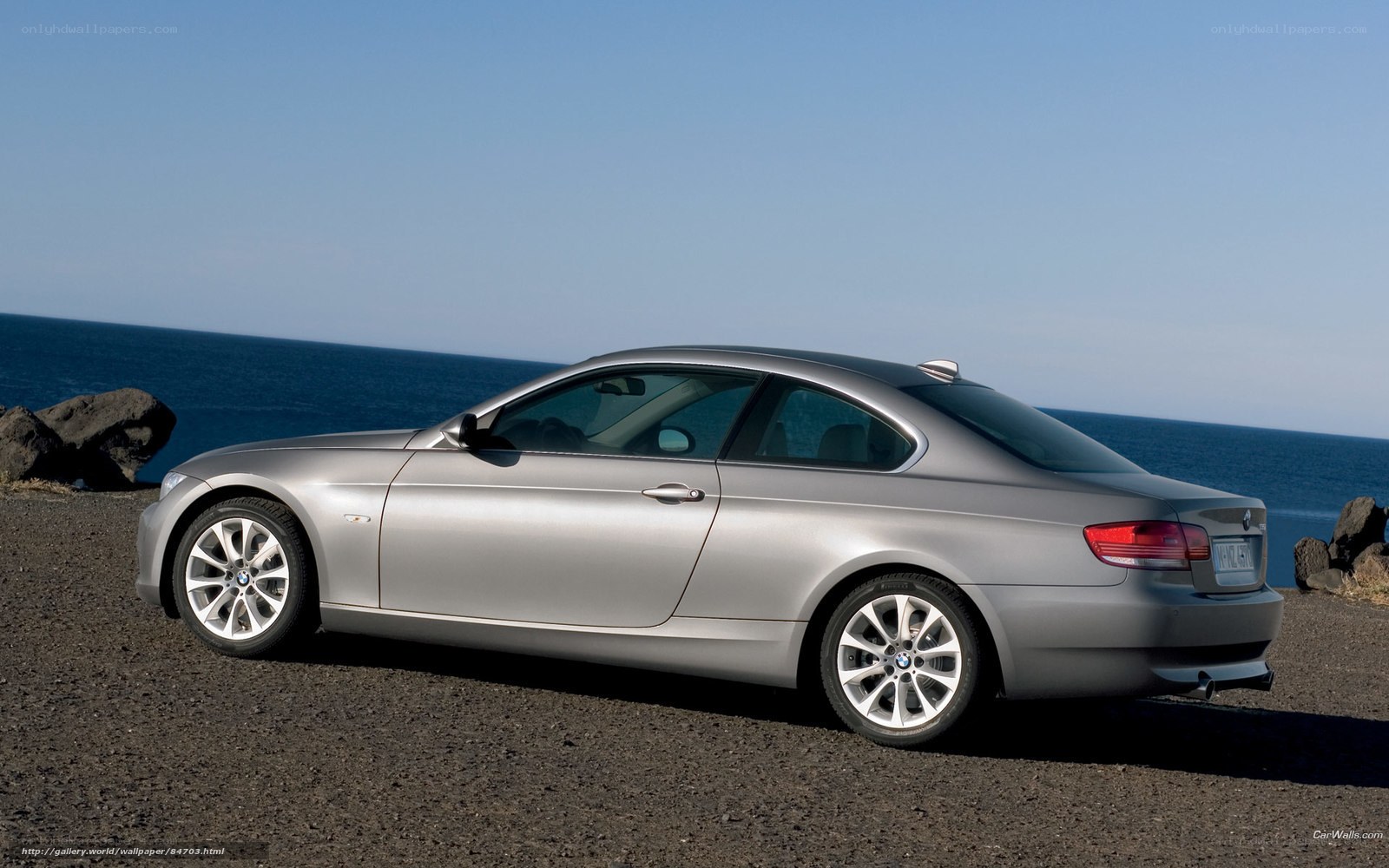 Silver BMW 3-Series Coupe by the sea