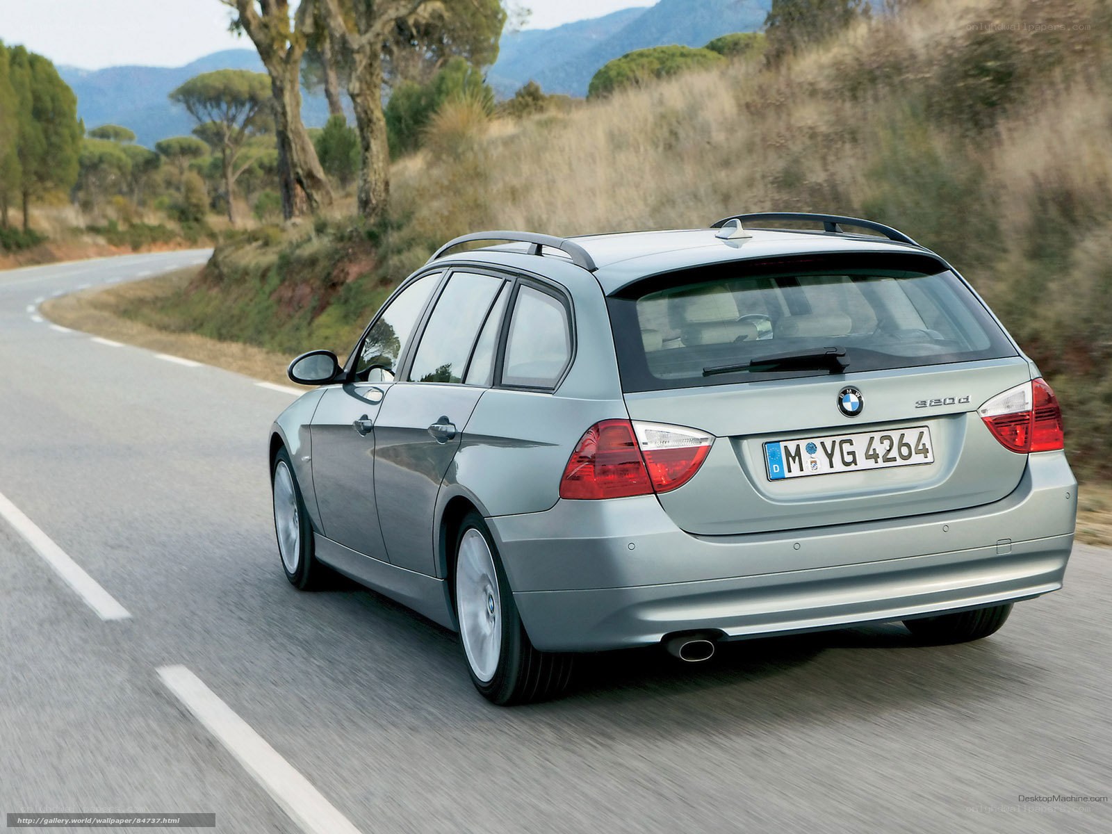 silver bmw 320d on a winding road