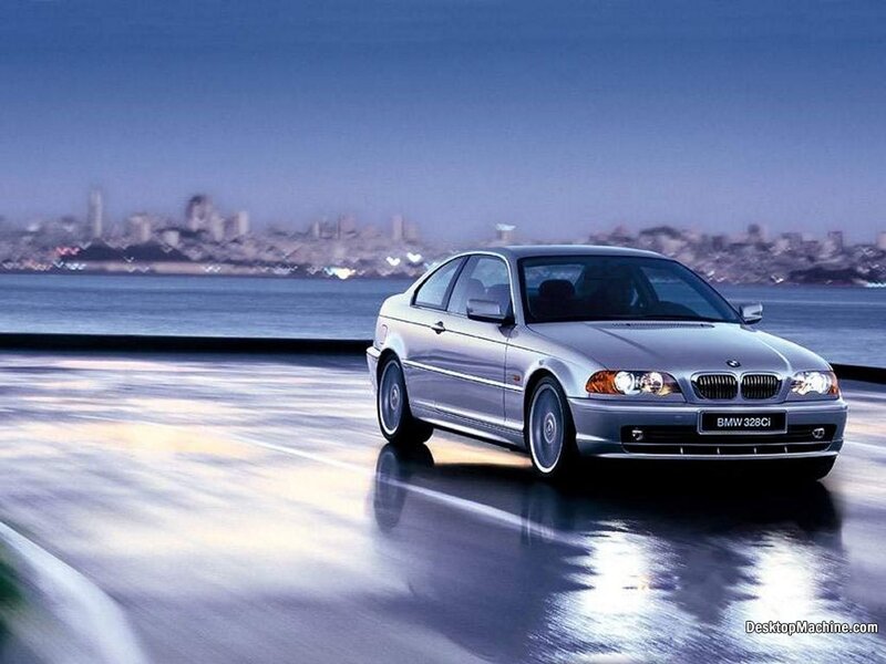 Silver BMW 328Ci on a coastal road