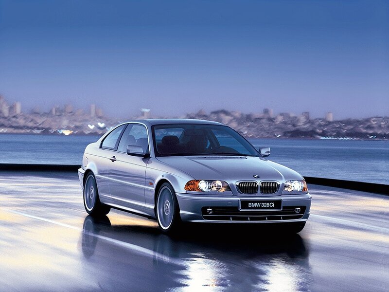 Silver BMW 328Ci on a coastal road