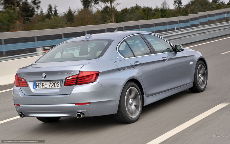 silver bmw 5-series driving