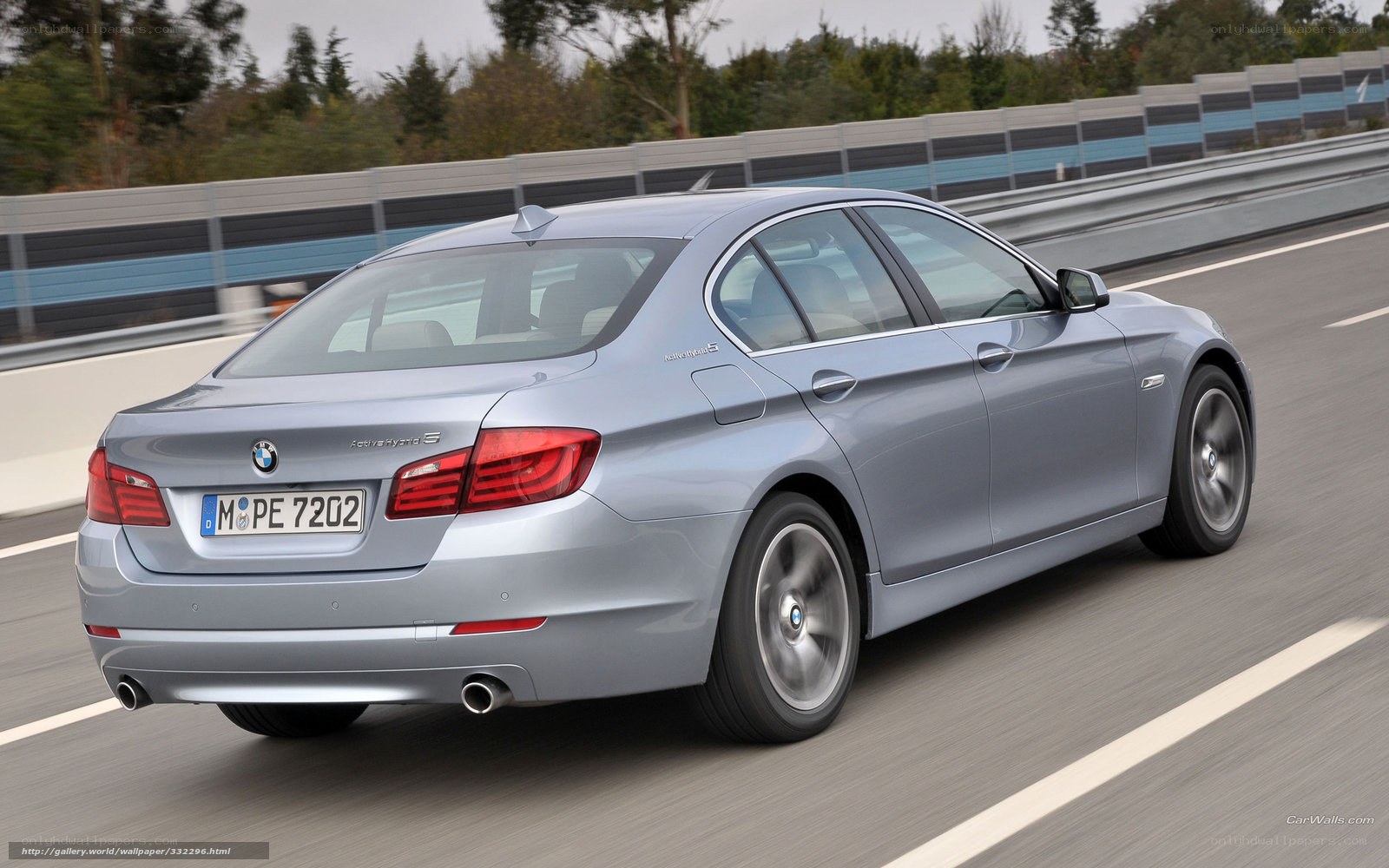 silver bmw 5-series driving