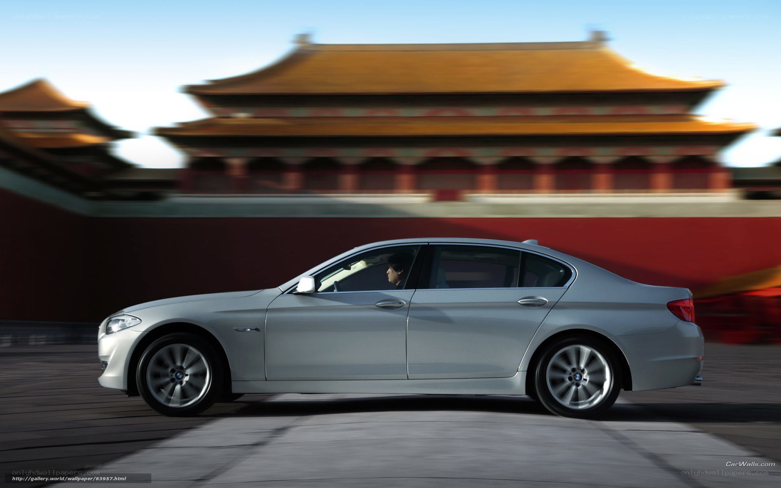 Silver BMW 5 Series in motion