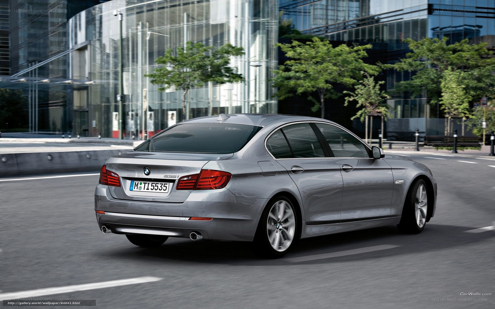 silver bmw 535i in city