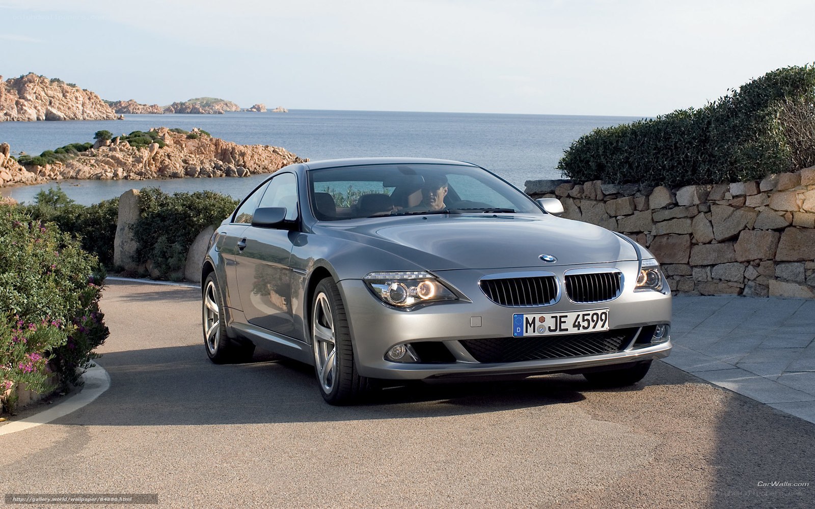 Silver BMW 6-Series by the sea