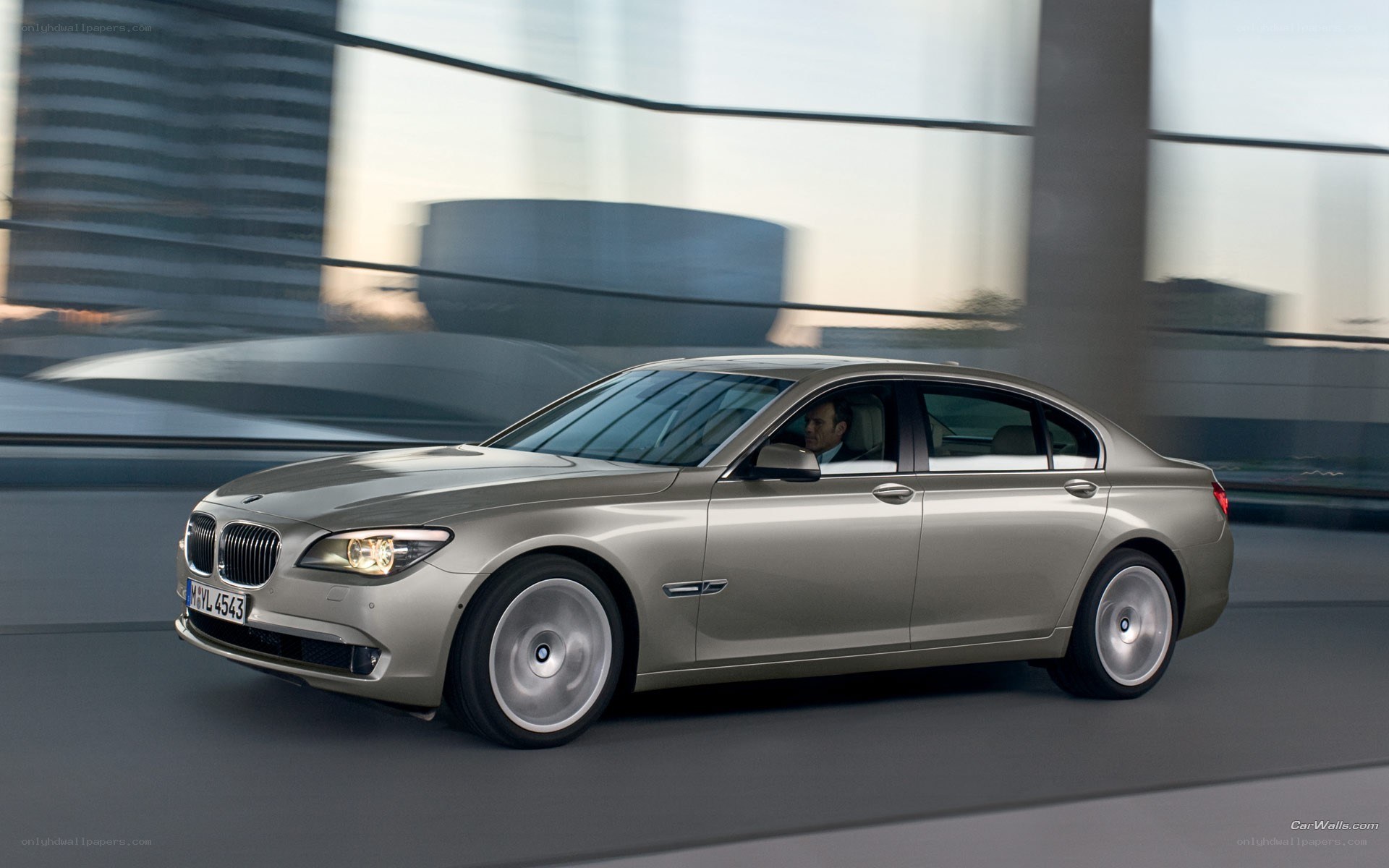 silver bmw 7 series in motion
