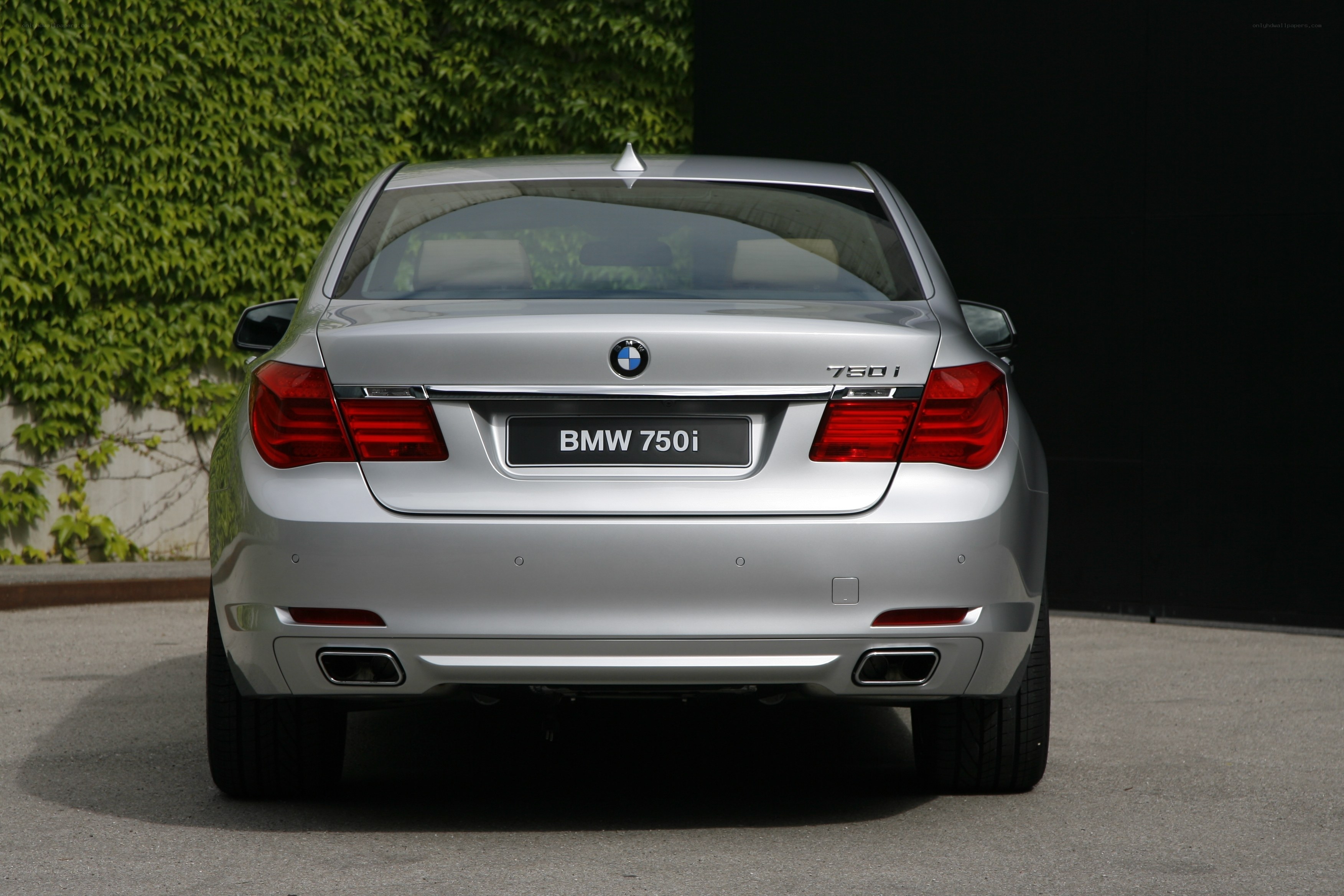Silver BMW 750i rear view