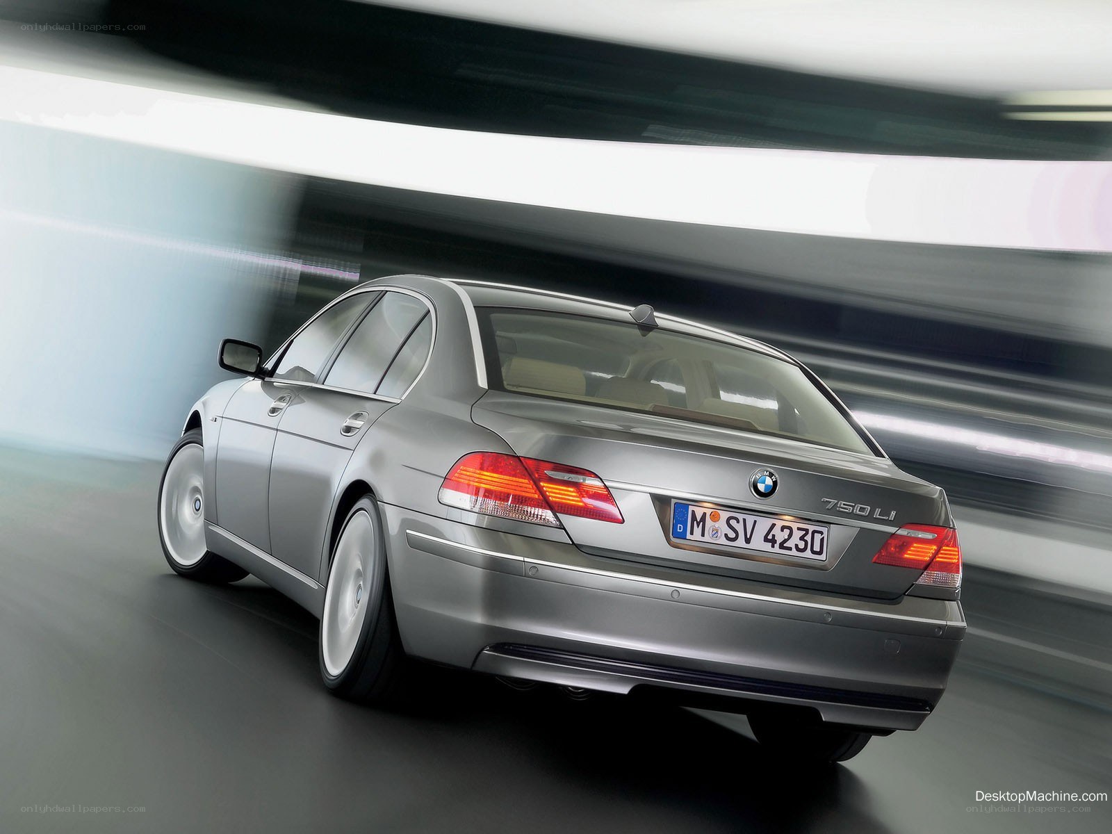 silver bmw 750li in motion