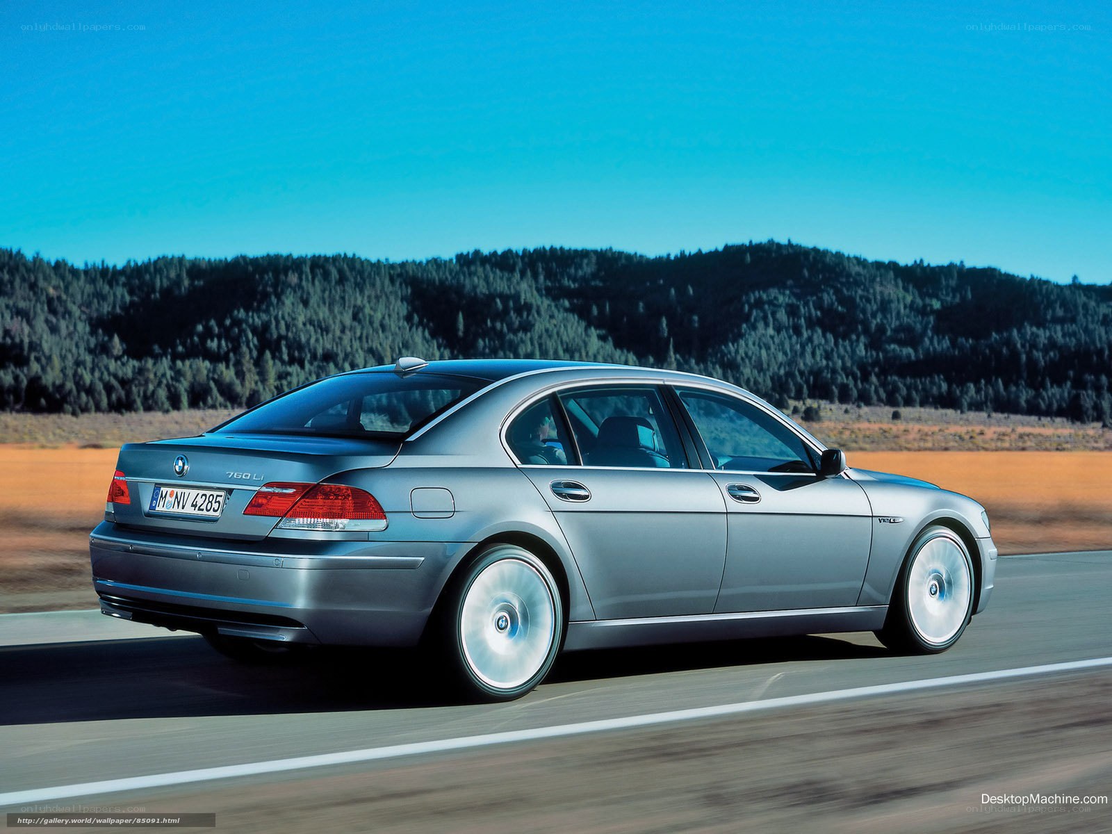 silver bmw 760li on road