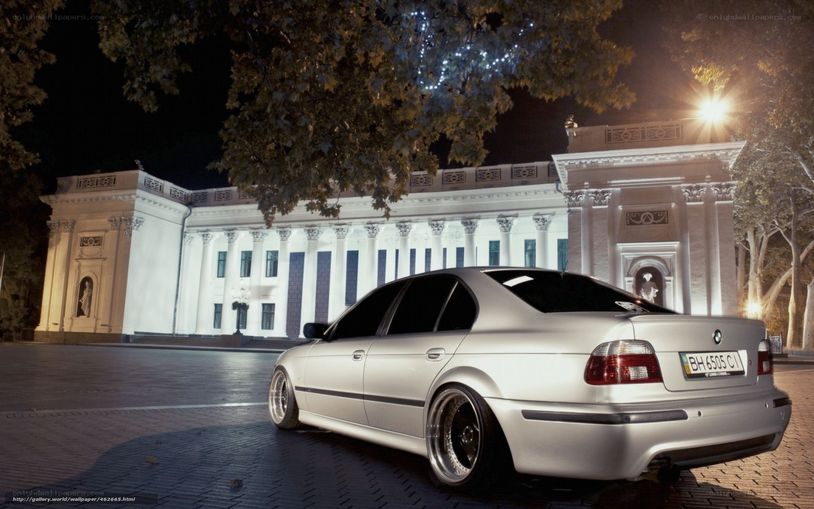Silver BMW at night