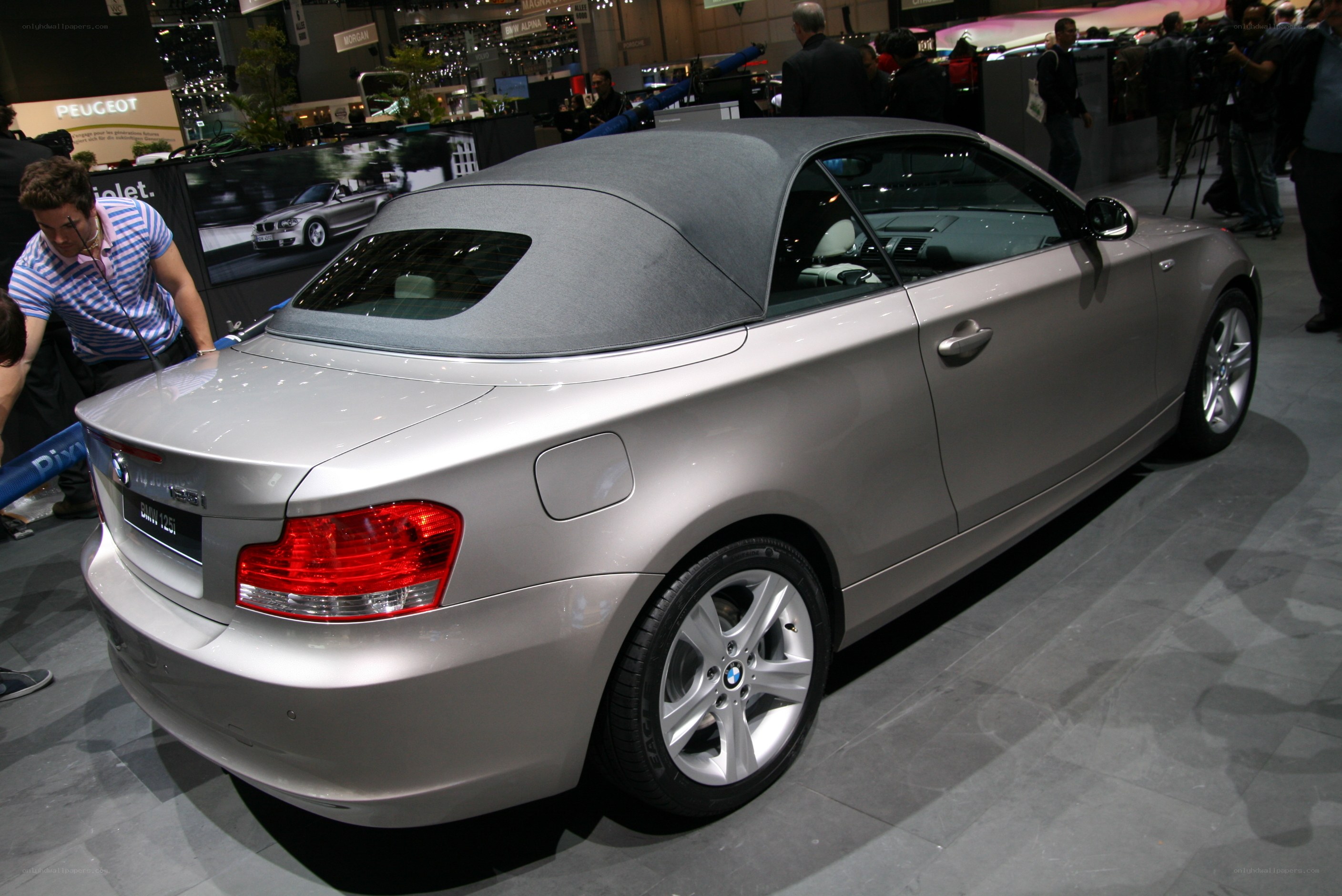 Silver BMW convertible at auto show