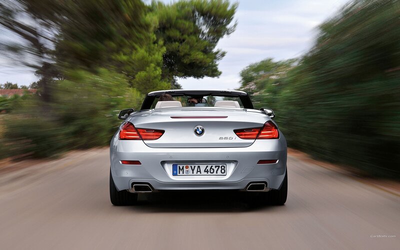 silver bmw convertible driving